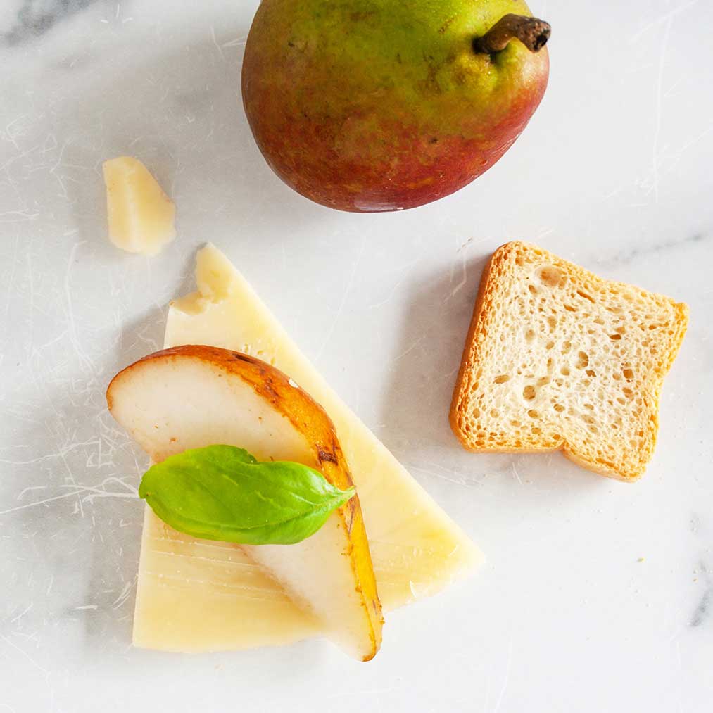 Aged Provolone Piccante wedge with characteristic pale yellow color and firm texture